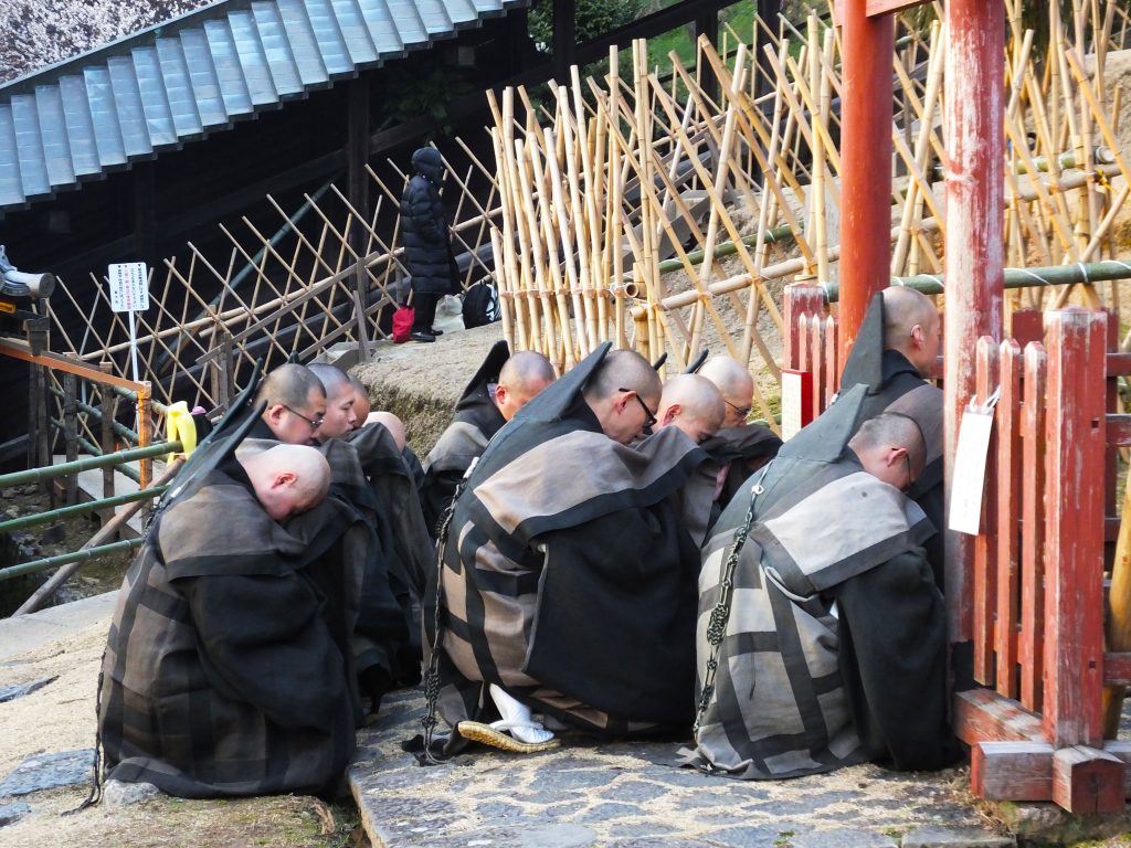 praying priests