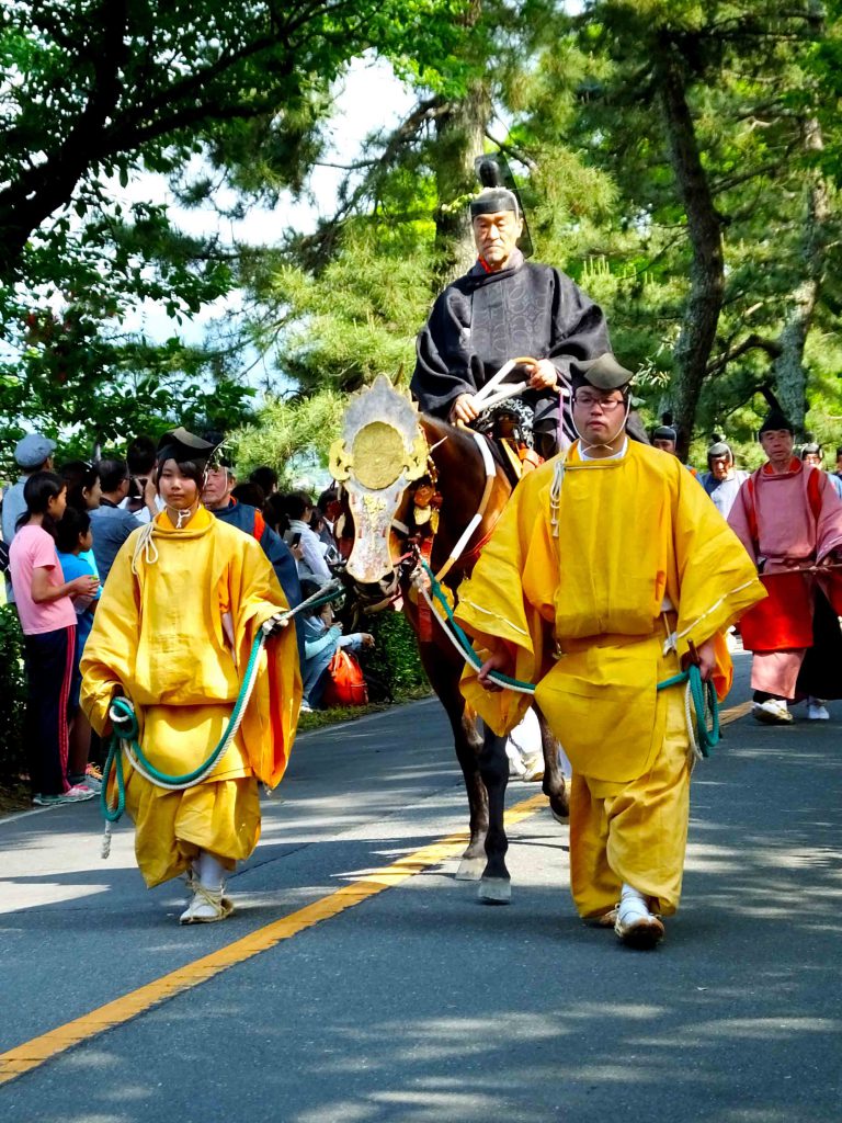 the man in the highest position and his horse weawring an iron mask