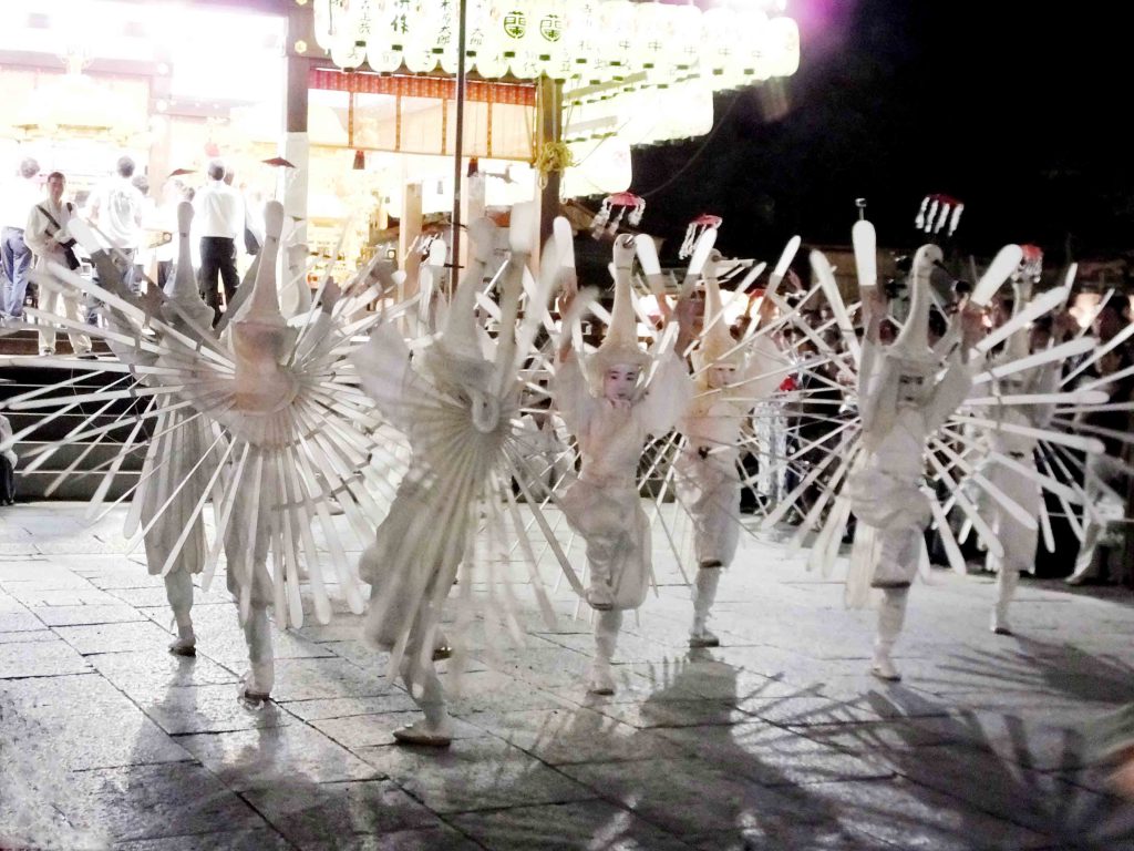 children in costumes of egrets