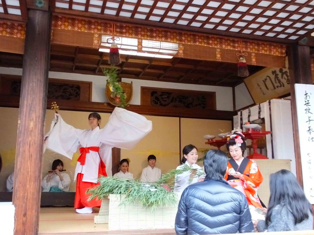 the dancing shrine maiden behind it