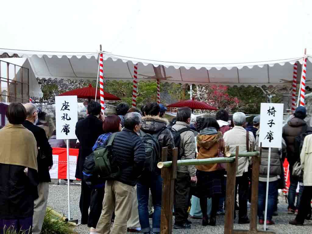 the-two-signs-in-front-of-the-tent